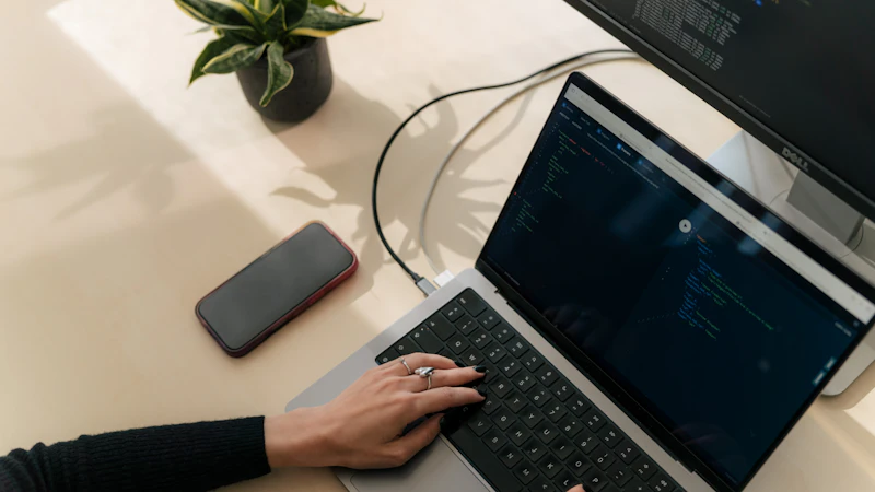 An engineer at a laptop representing Level 2 AI adoption